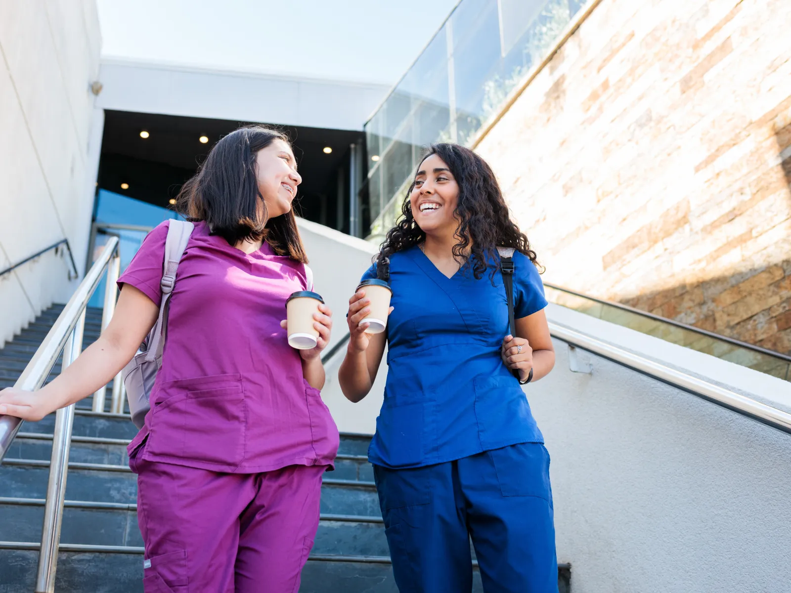 Shirin Neshat et al. smiling and standing on a bridge