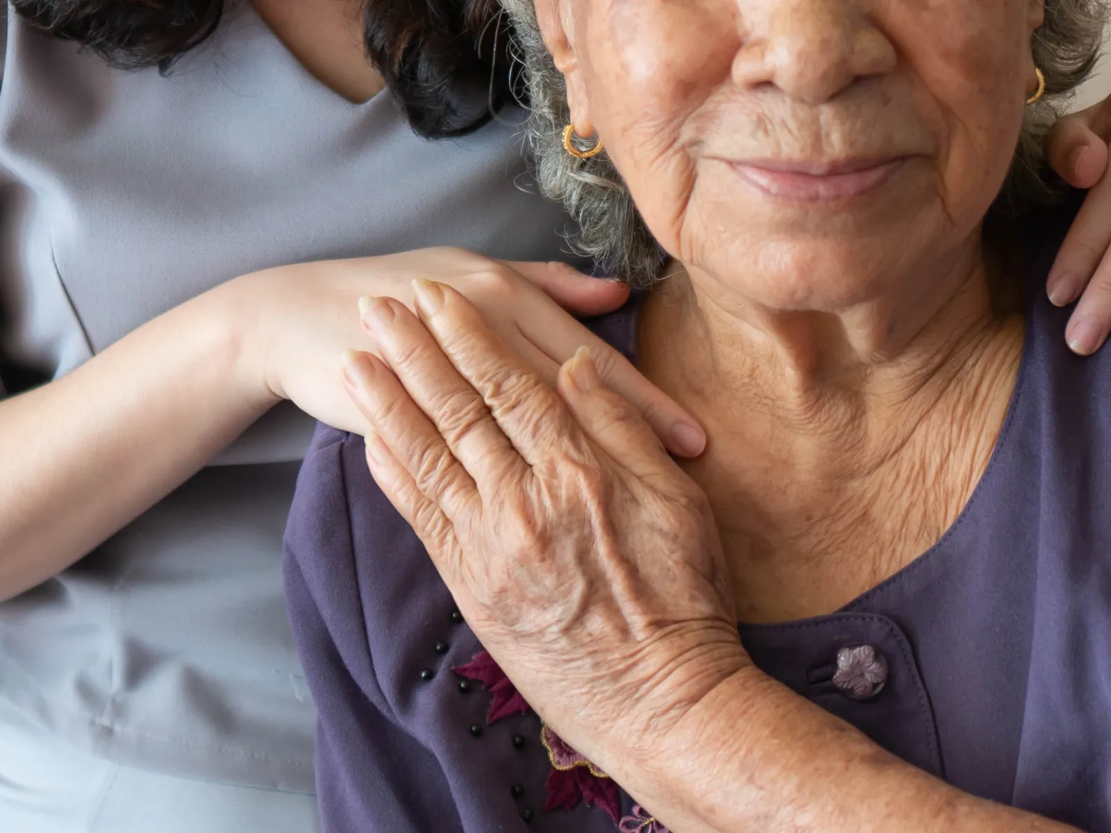 a person holding the hands together