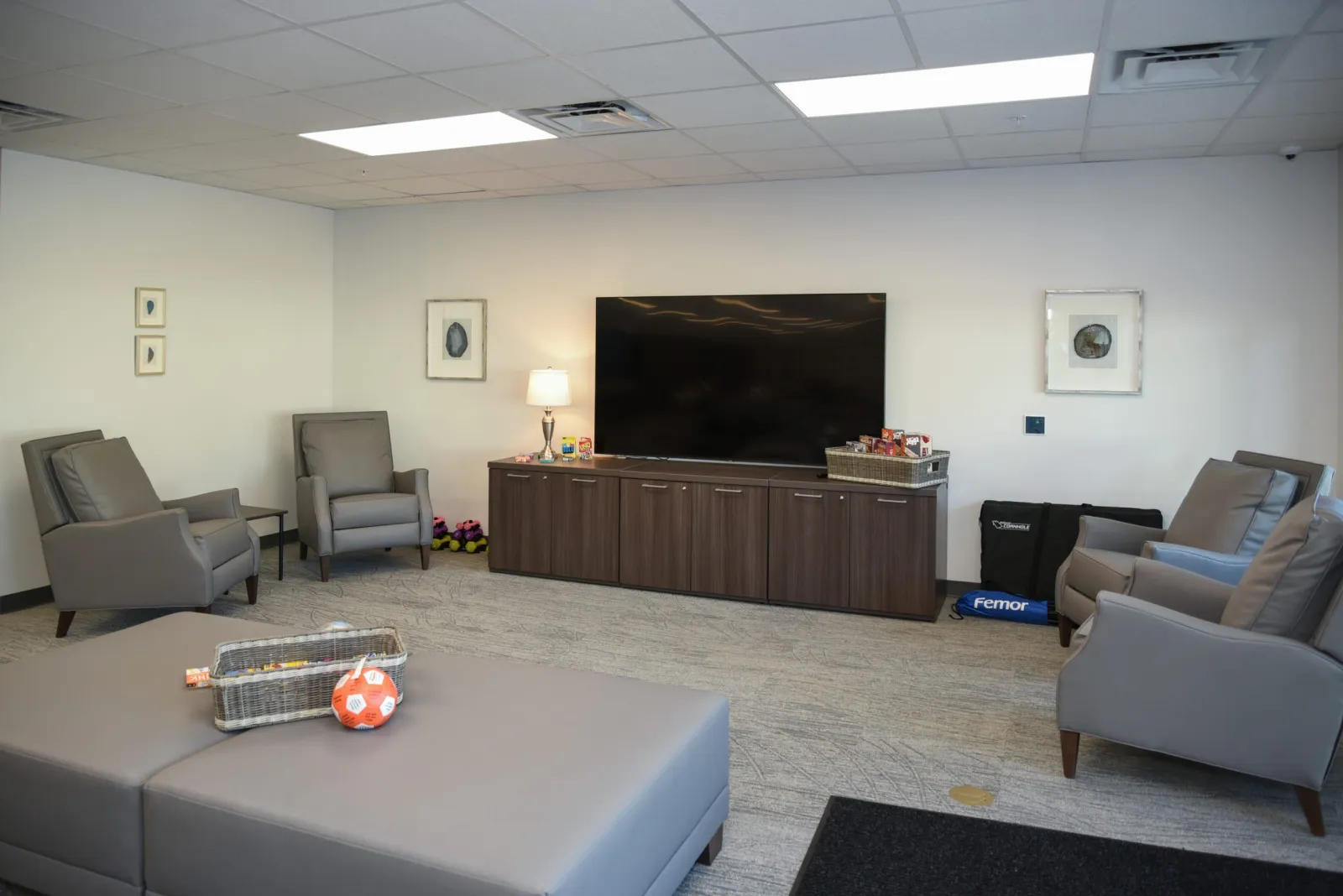 a living room with a tv and couches