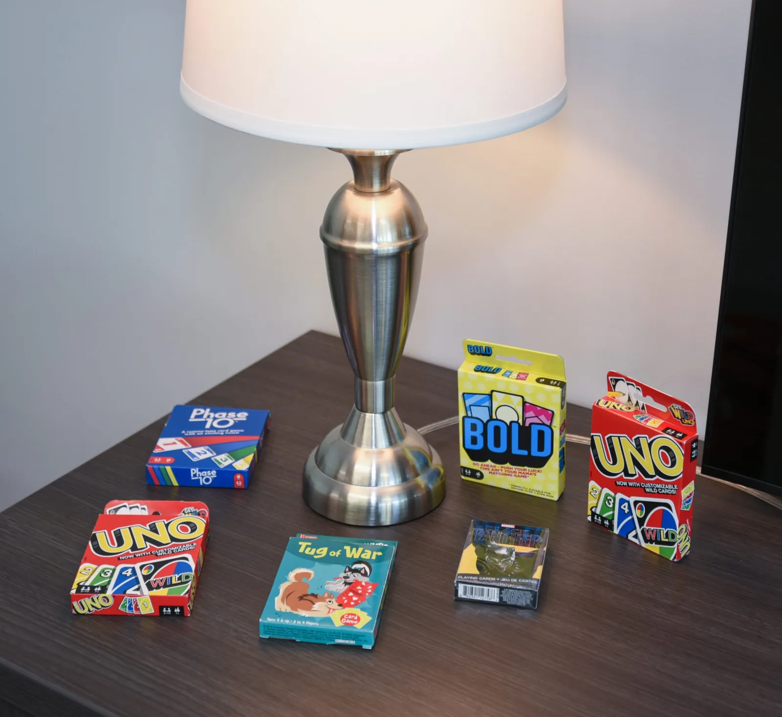 a table with a lamp and boxes of candy on it