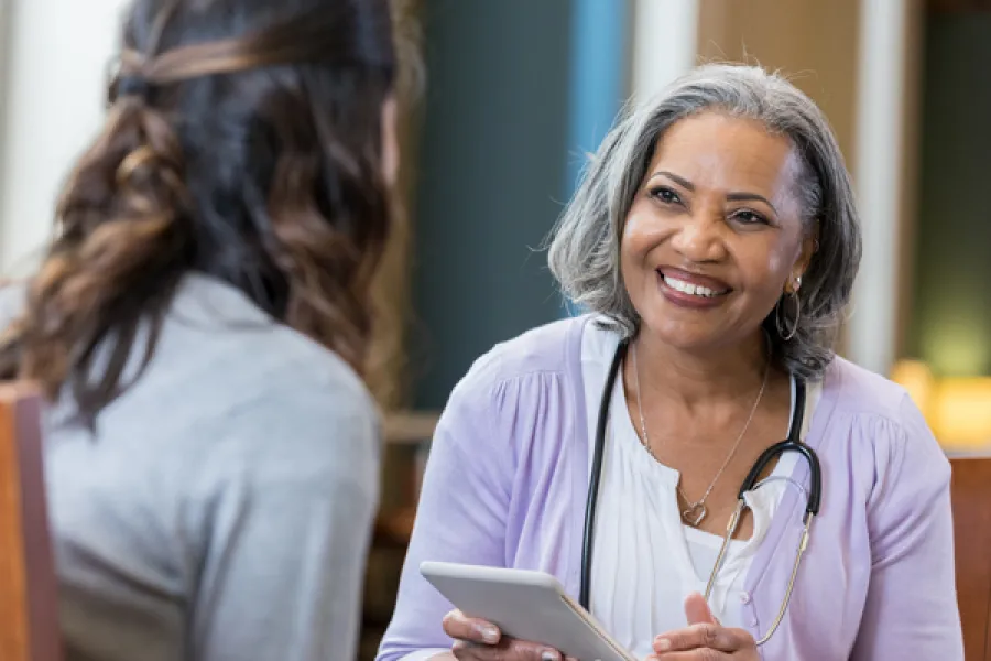 Cheryl James smiling at something
