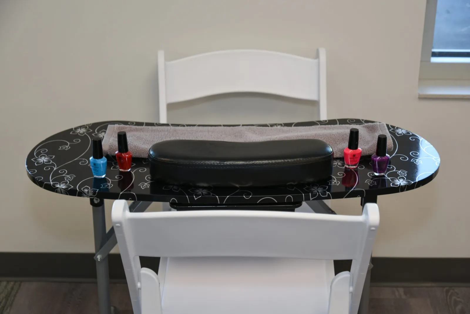 a table with a white chair and a white table with a white tablecloth and a white table