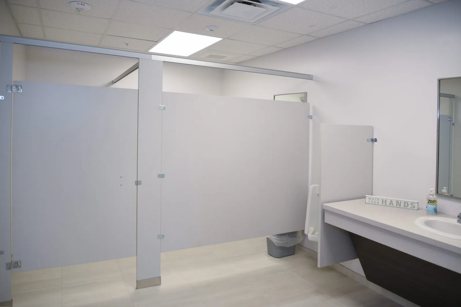 a bathroom with a sink and a shower unit