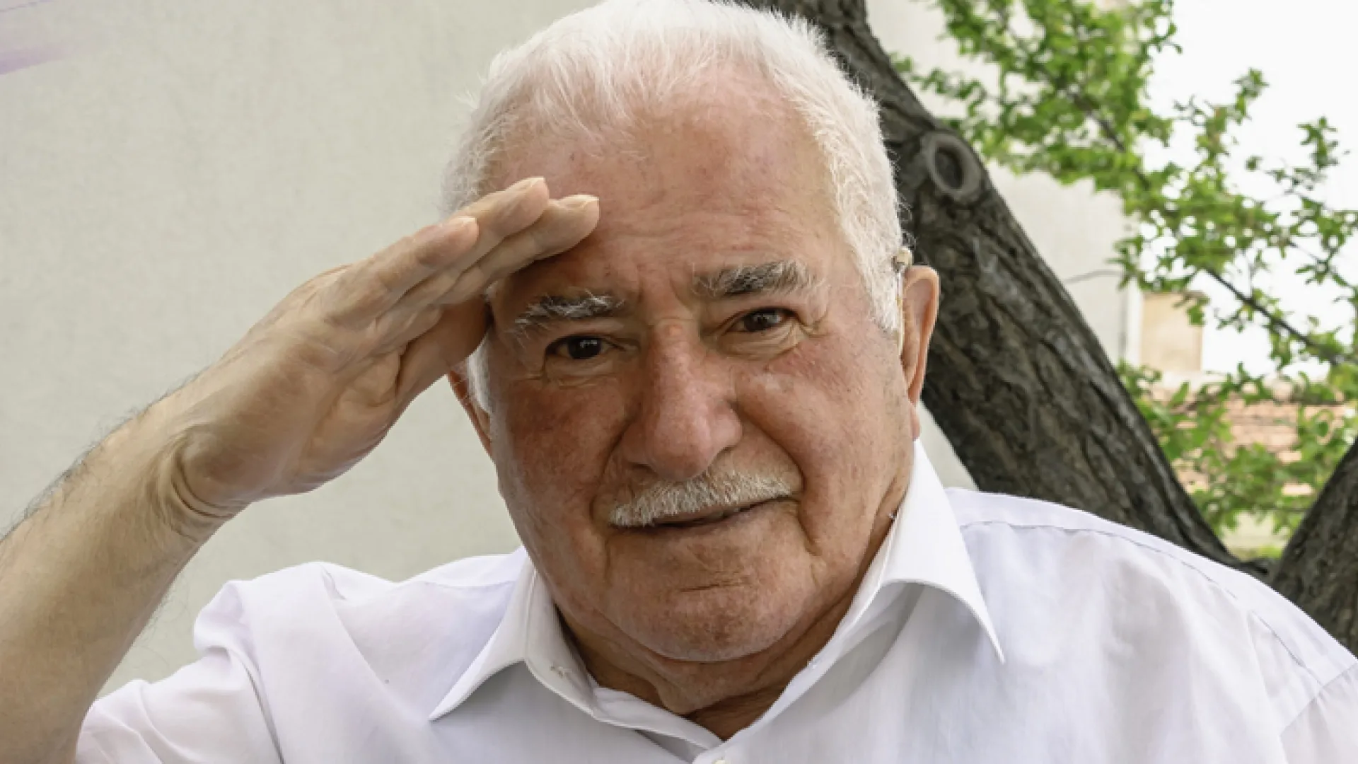 a man with his hand on his head