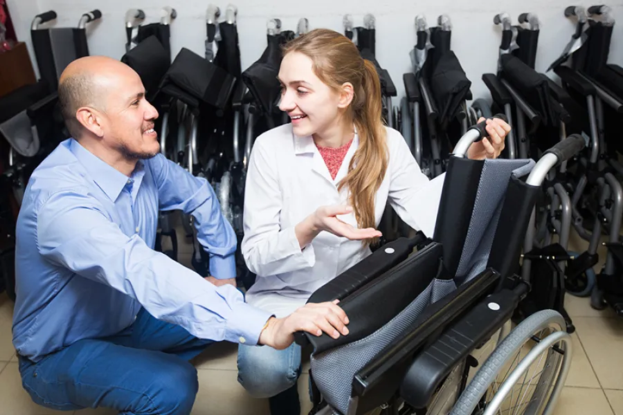 a man and a woman in a wheelchair