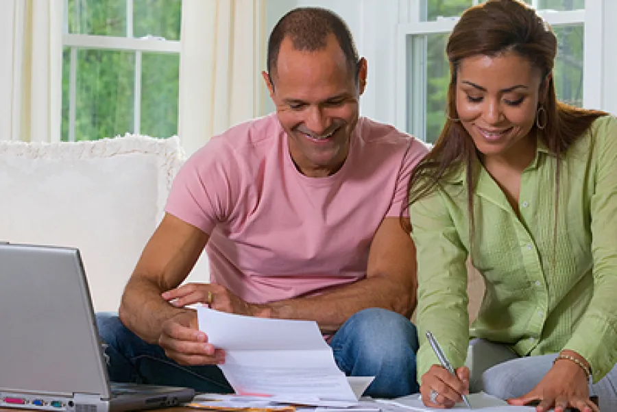 a man and a woman looking at a book