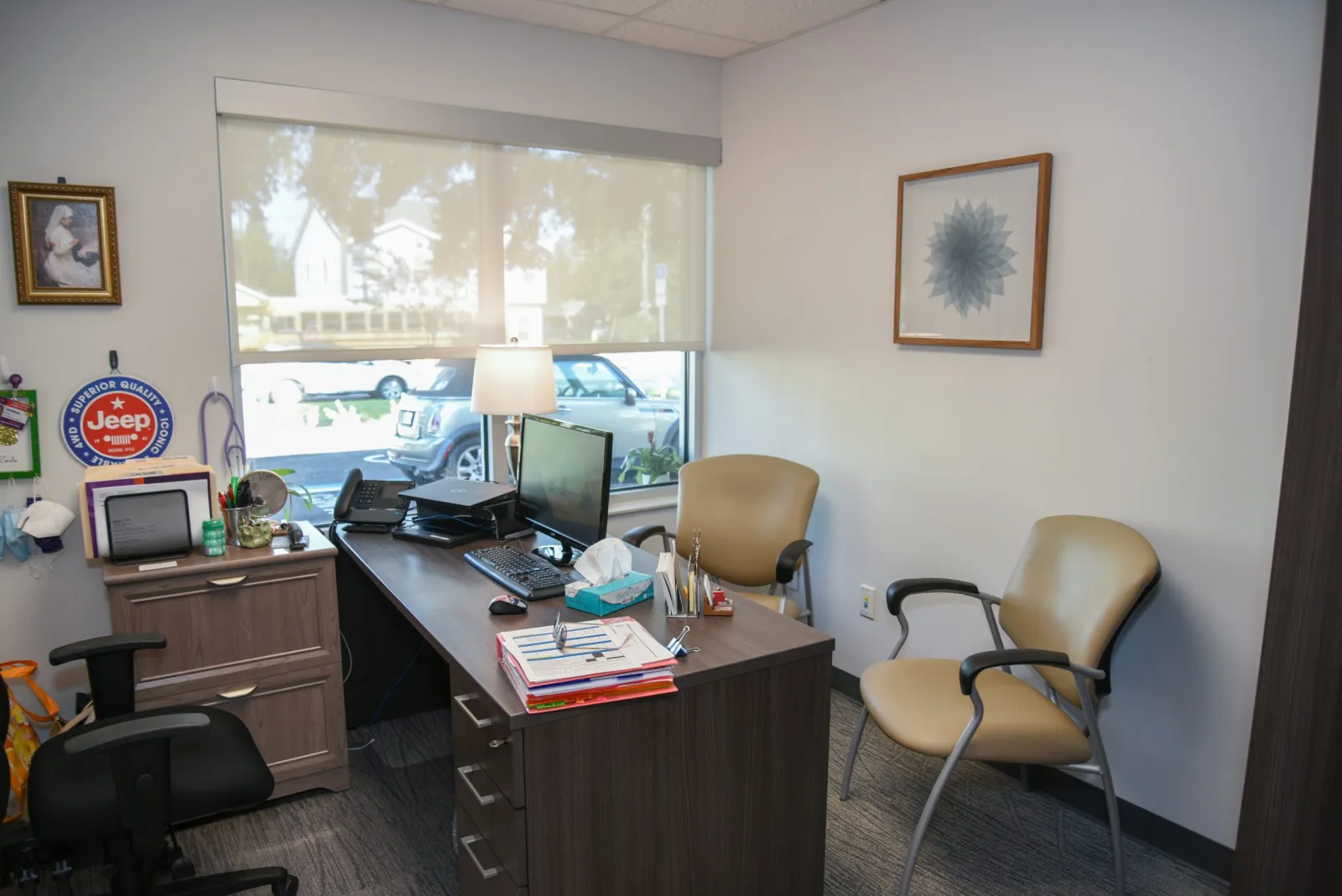 a room with a desk and computer