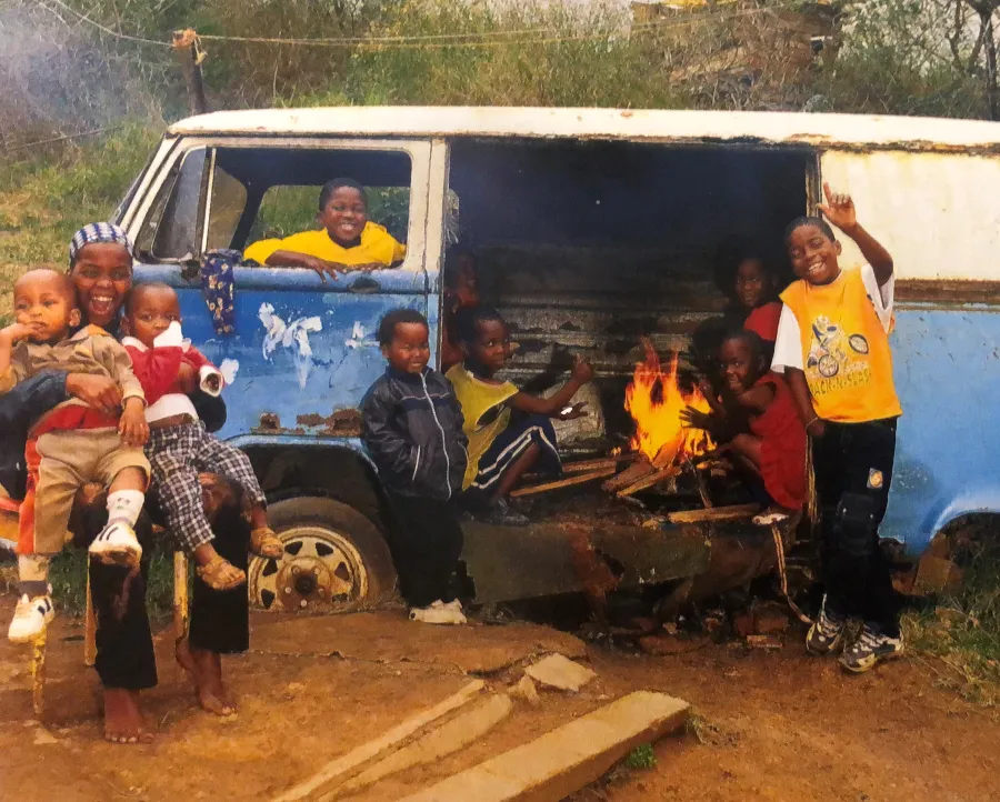a group of people around a truck