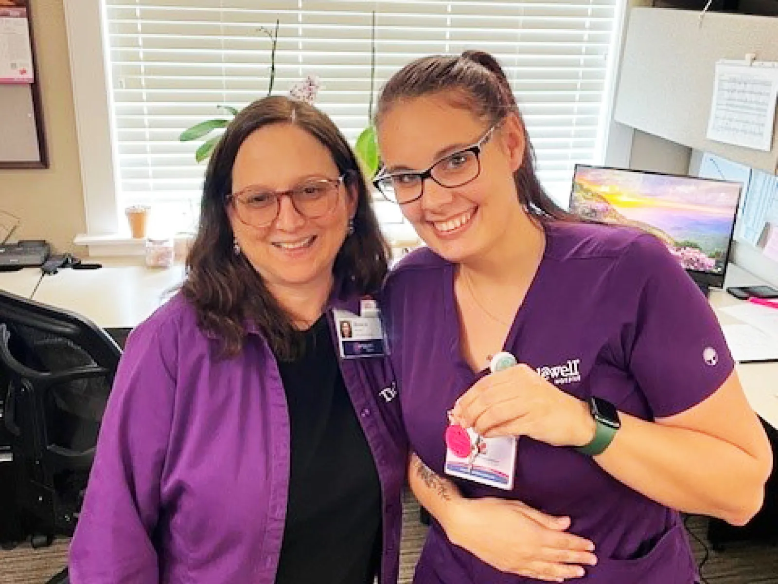 a couple of women smiling