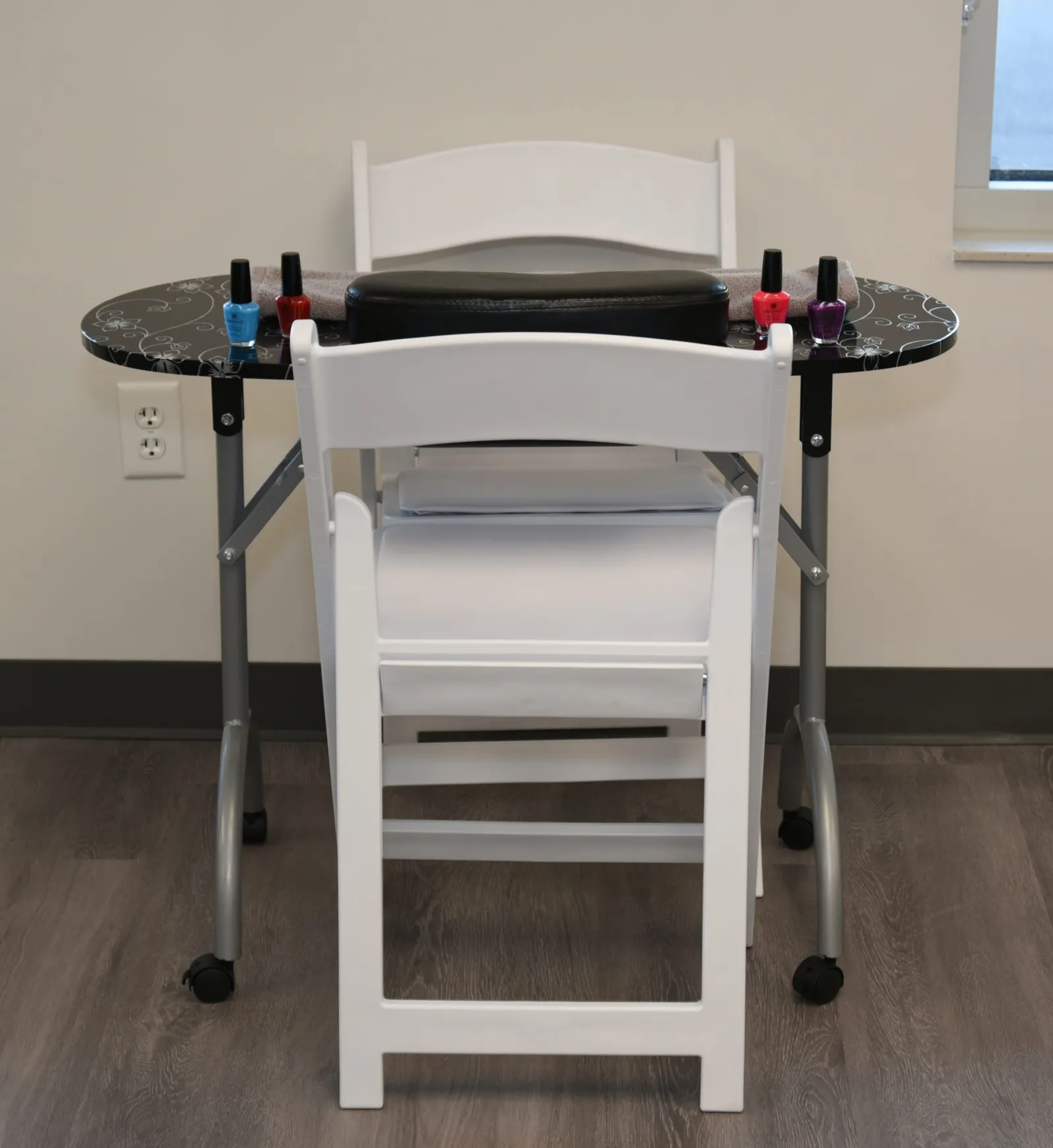 a chair with a table and a table with objects on it