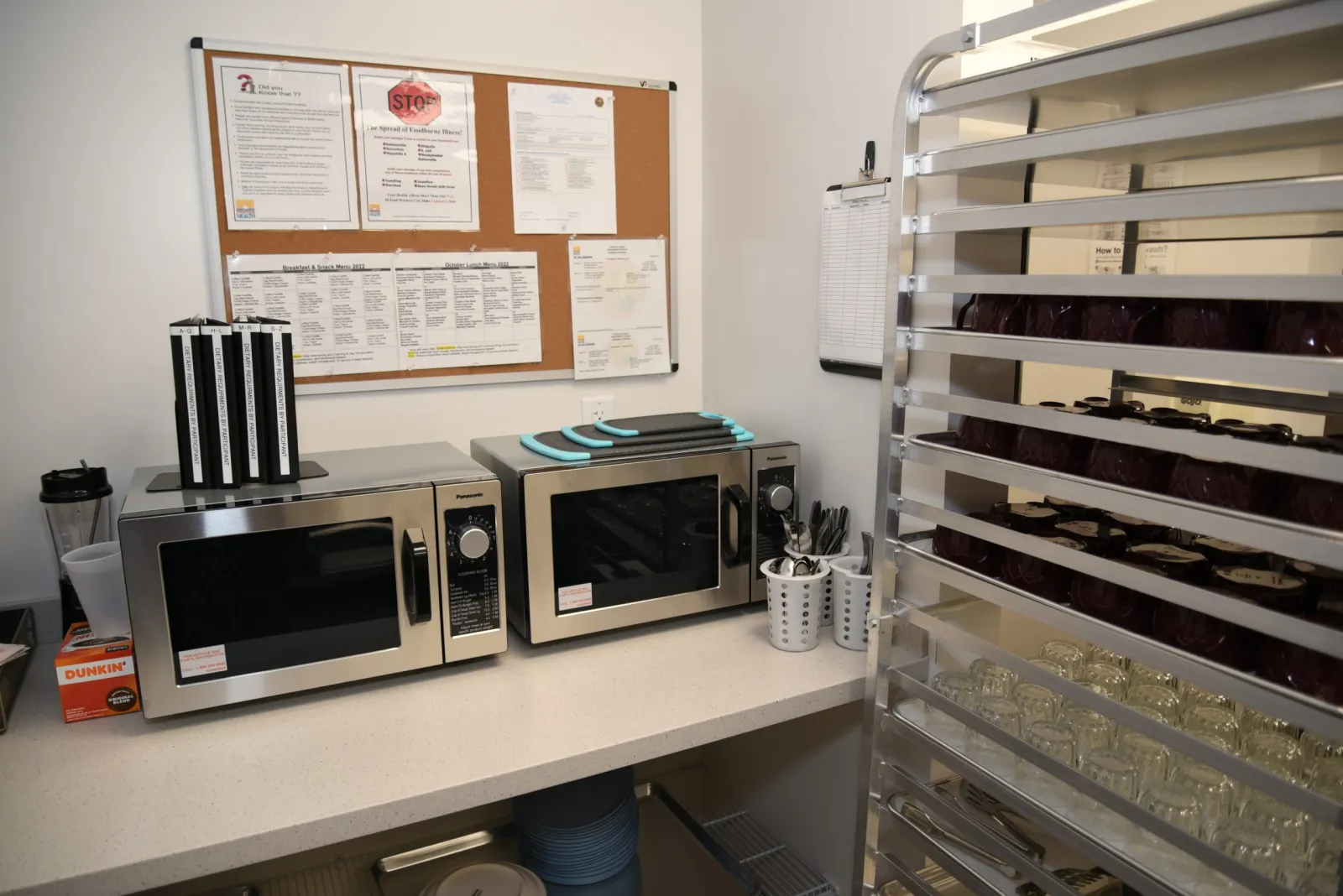 a kitchen with microwaves and refrigerator