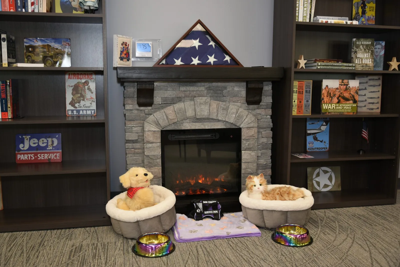 a fireplace with a stuffed animal in front of it