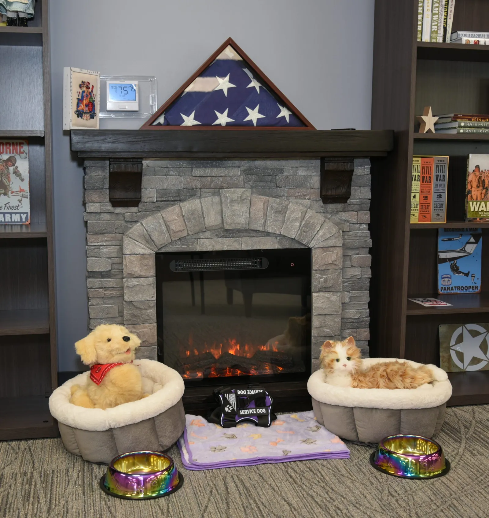 a fireplace with a stuffed animal in front of it