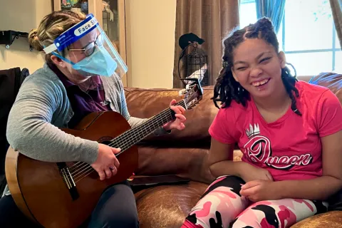 Music Therapy Sessions Get Teen Moving, Playing Along